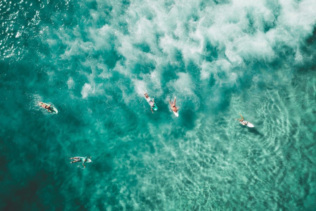 Drone footage of surfers in the ocean