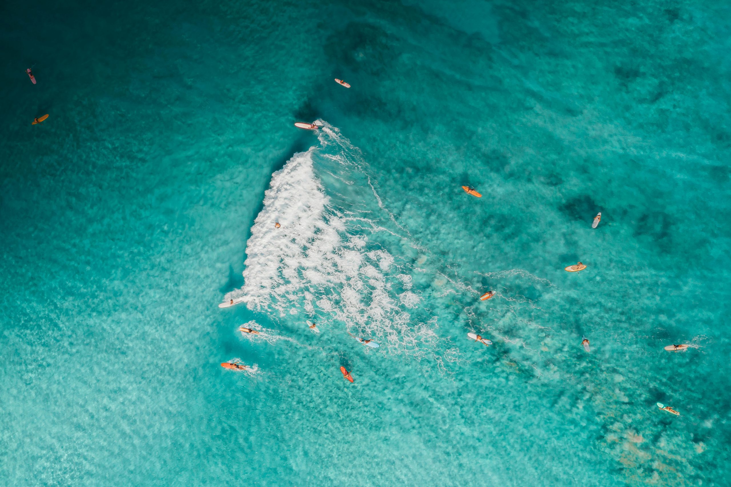 Surf wipeout guide. Surfers surfing in the ocean. Drone footage.