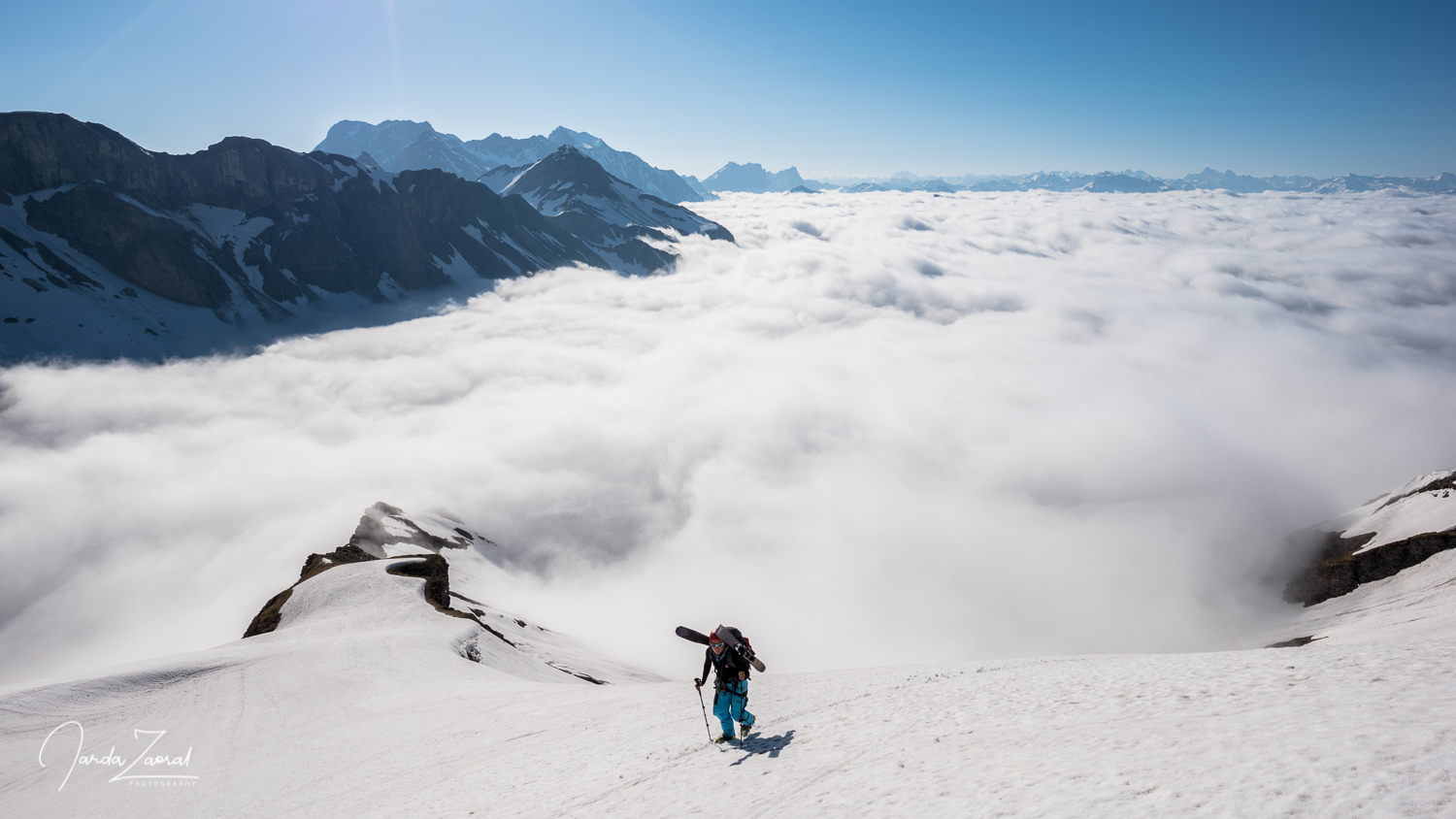 Climbing above clouds in the Alps