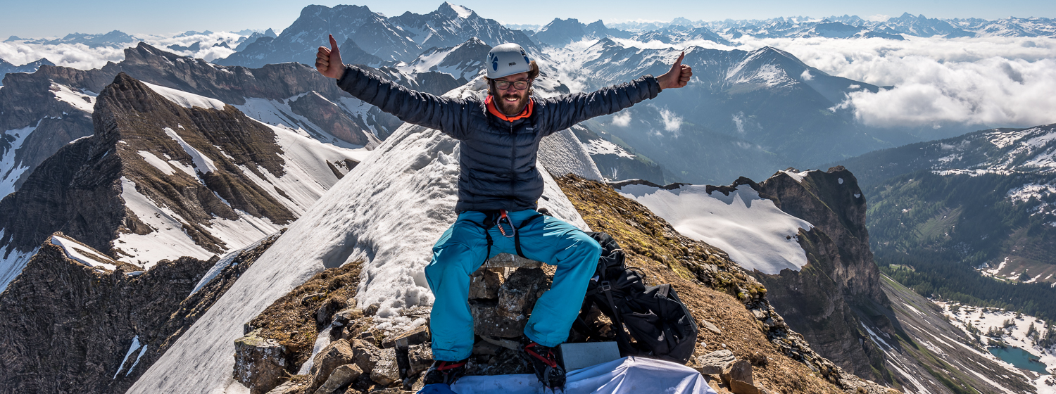 Climber on top of mountain Vorder Grauspitz