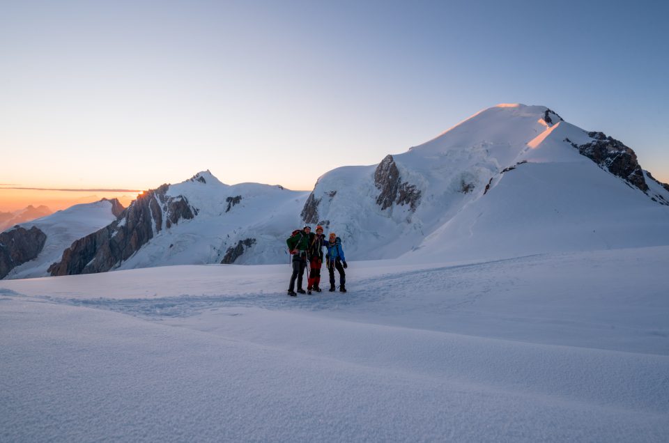 Three climbers in front of Mont Blanc mountain