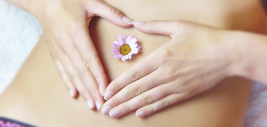 lady stomach with heart and flower