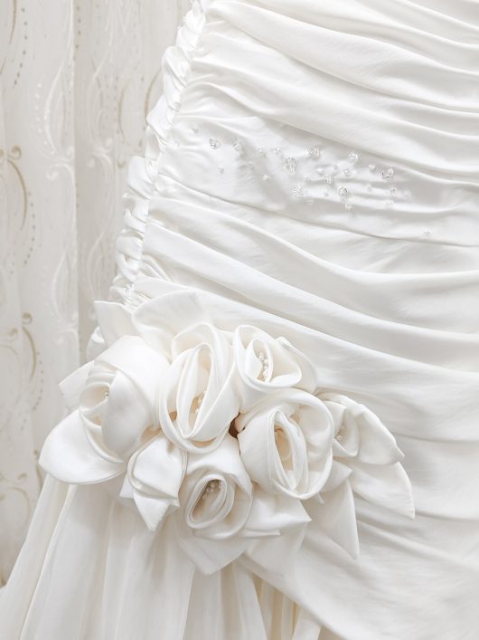 A -line wedding dress with ruching and fabric corsage detail - croydon bridal shop -- designer sample sale