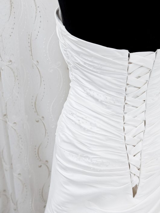 A -line wedding dress with ruching and fabric corsage detail - croydon bridal shop -- designer sample sale