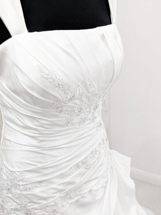 Beautiful white wedding dress with ruched side detail - pleated side with beads, stones and jewel - lace up back #londonbridalshop