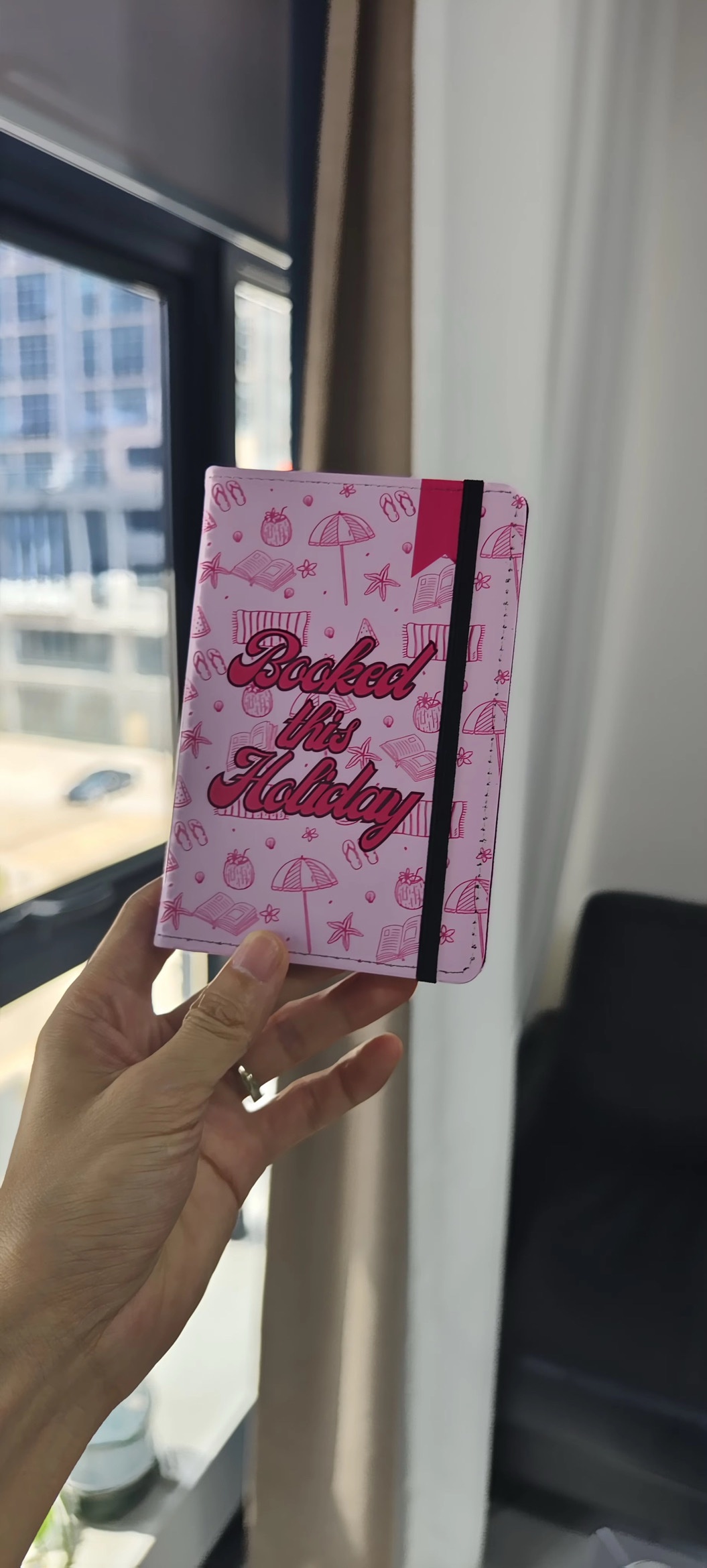 Passport holder – Booked this holiday
