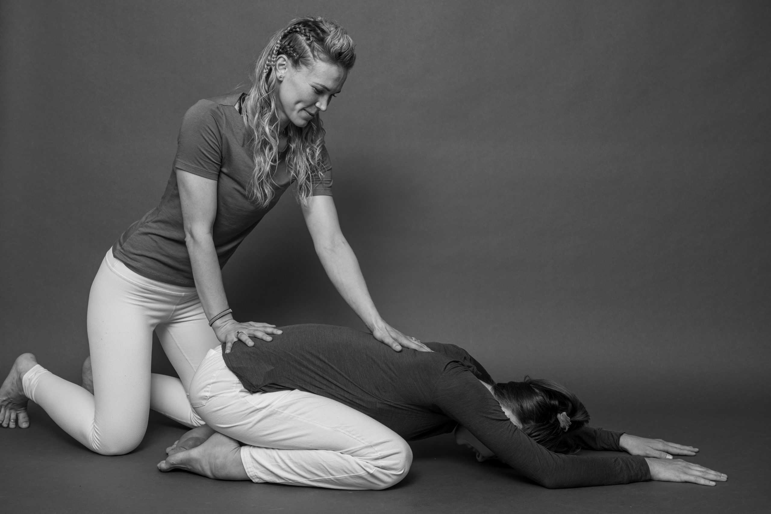 Daniella assisting a client stretching