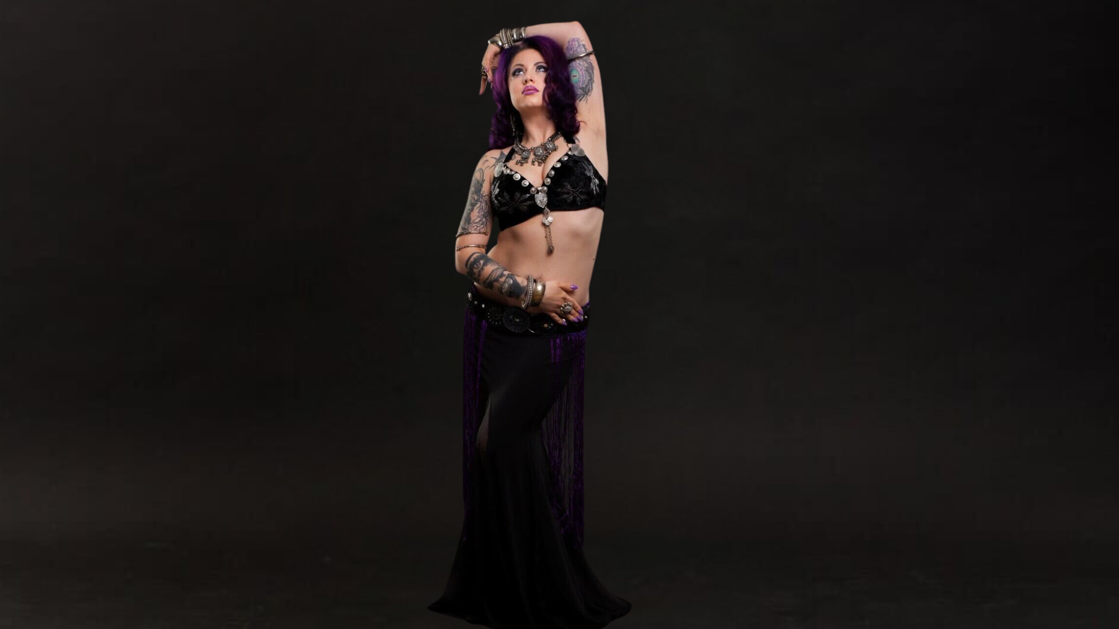 Tribal fusion facilitator on black dress