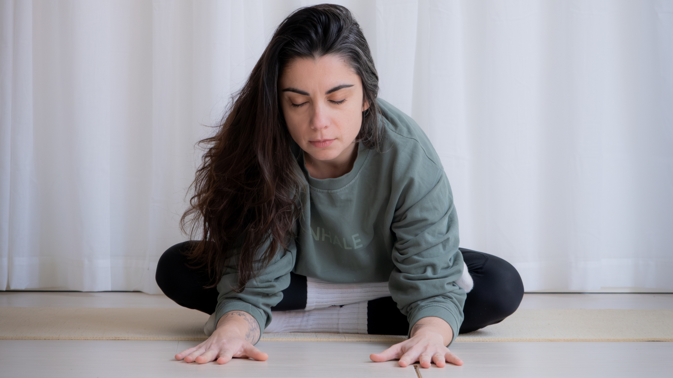 Ioana staff at the Sage Oslo wellness center stretching in the yoga shala