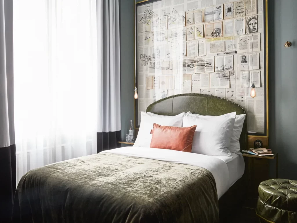 Elegant Sir Savigny hotel bedroom with contemporary decor.