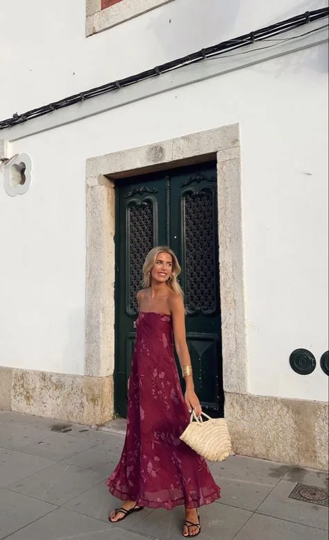 woman wearing a long and bordeaux dress