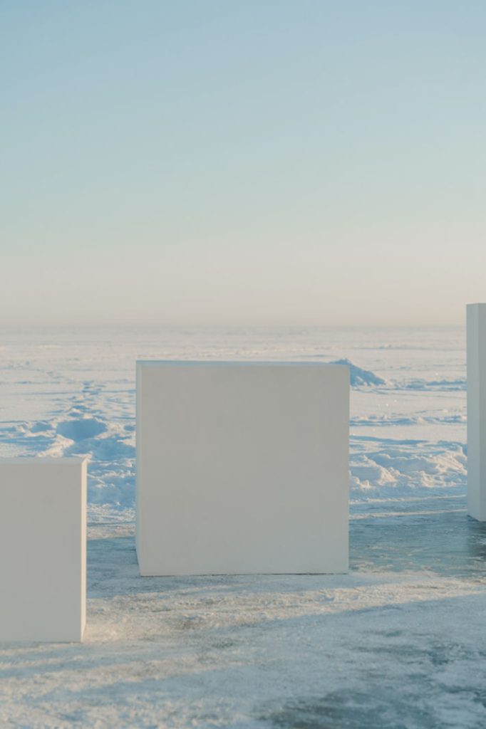 White squared box in Antarctica with ice landscape