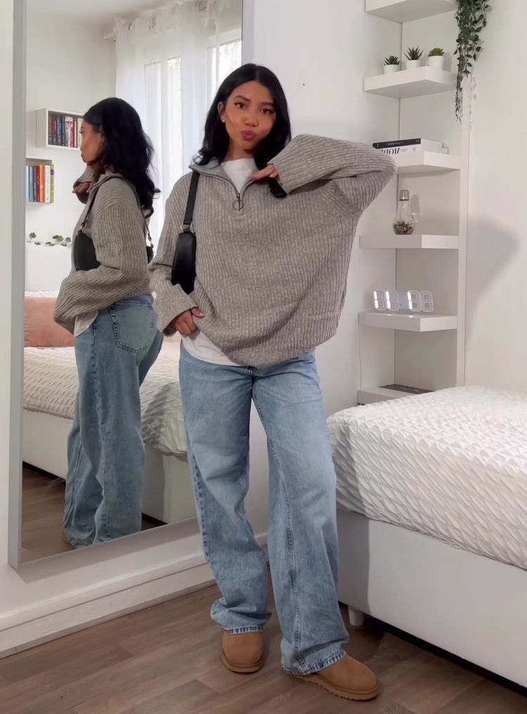 Woman wearing jeans and a sweater