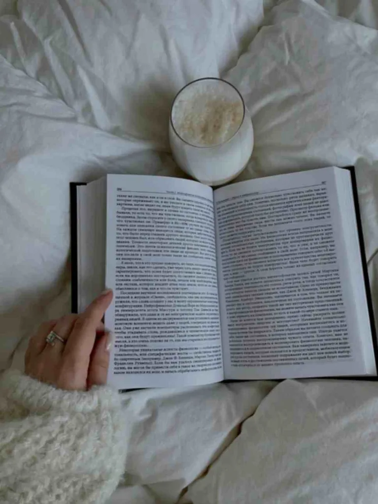 Book with beverage in the bed. Pexel resource free to use.