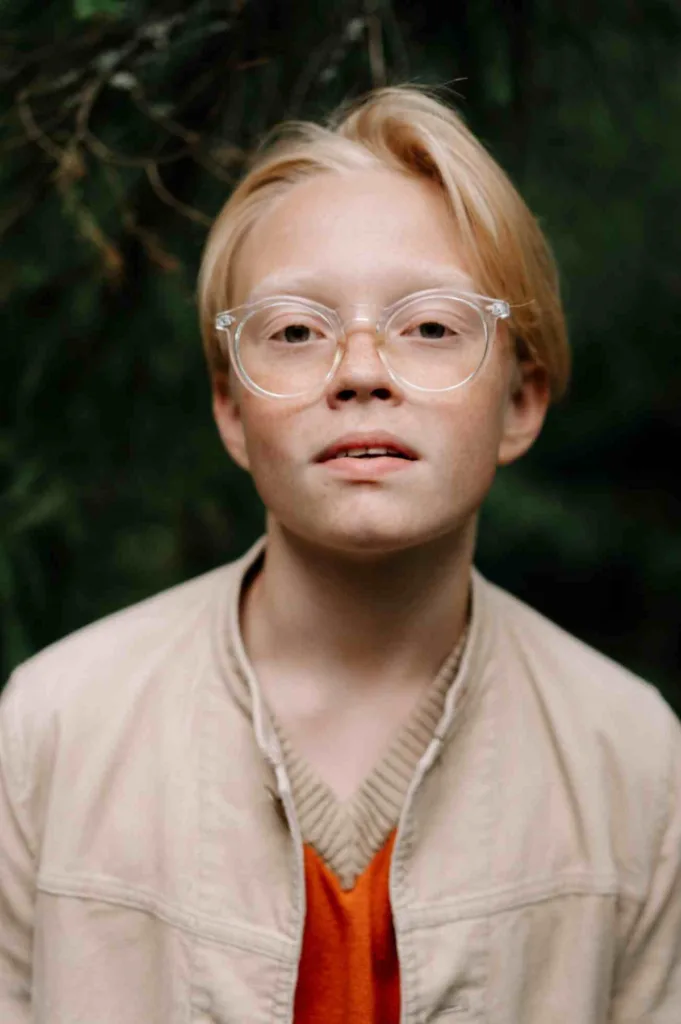 A blond young boy's portrait showcasing best books 2024 for teens. Free to use Pexel image.