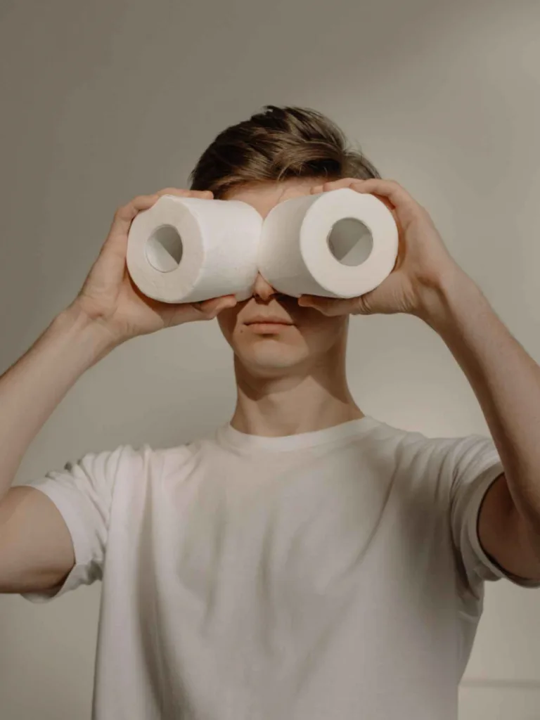 Boy with toilette papers in his eyes showcasing juvenile behavior to reference Home Alone movie.