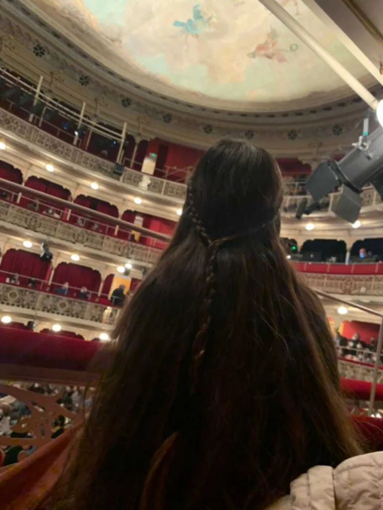 Isabella Cerullo watches a theater play in Teatro de Lope de Vega, Madrid.