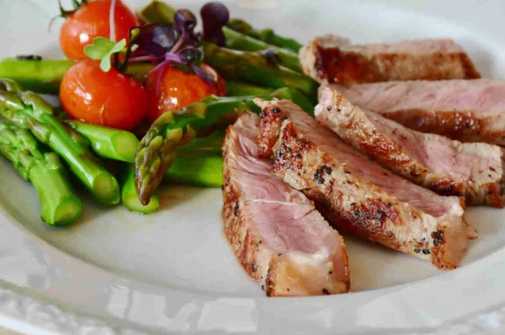 Eat Healthy. Tomatoes, meat, asparagus on a plate.