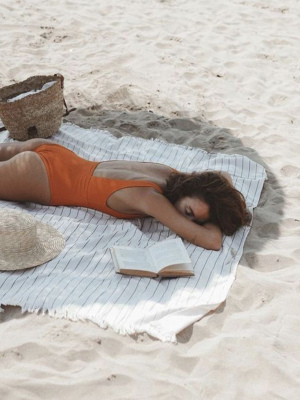 girl sleeping at the beach