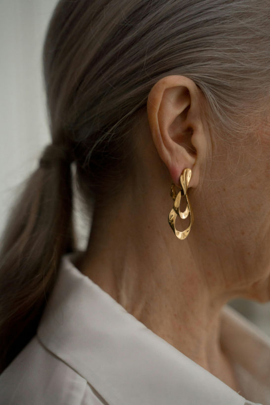 close up of gold chunky earrings