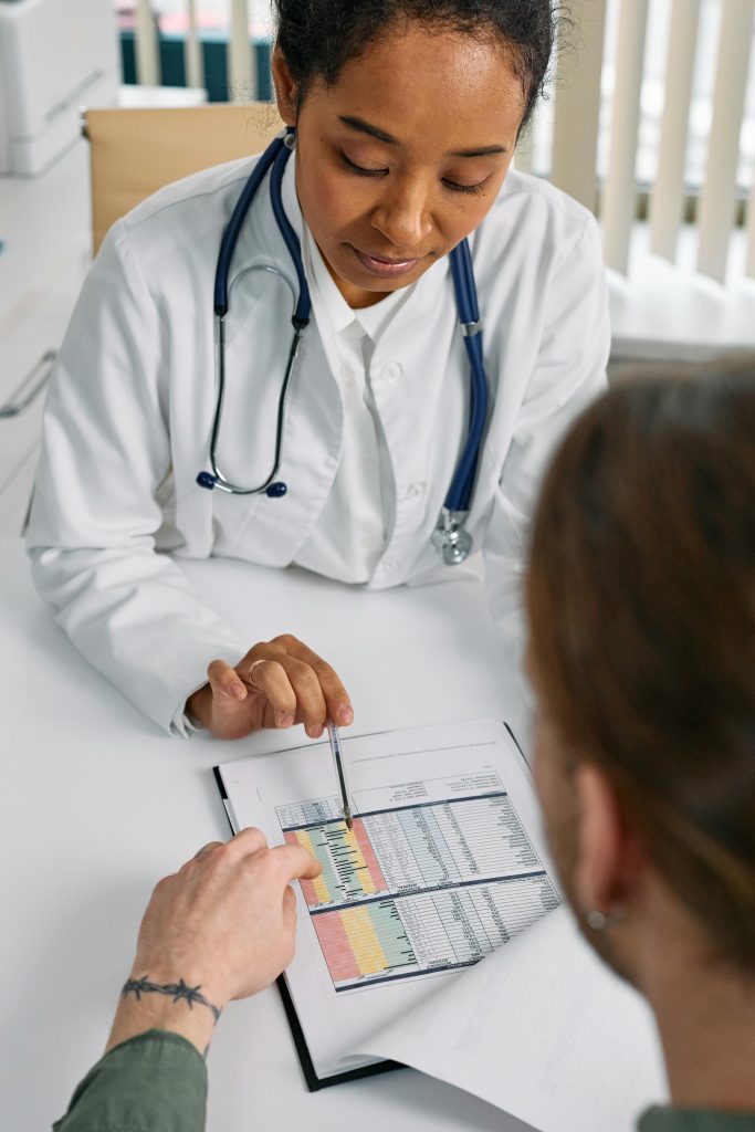 doctor consulting woman on her cortisol levels blood test