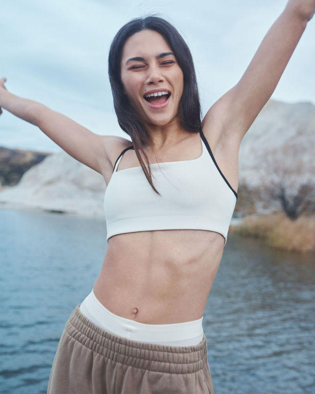 girl in white sports bra for pilates workout