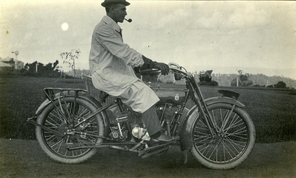 motorcyclist wearing driving gloves and duster 1910s