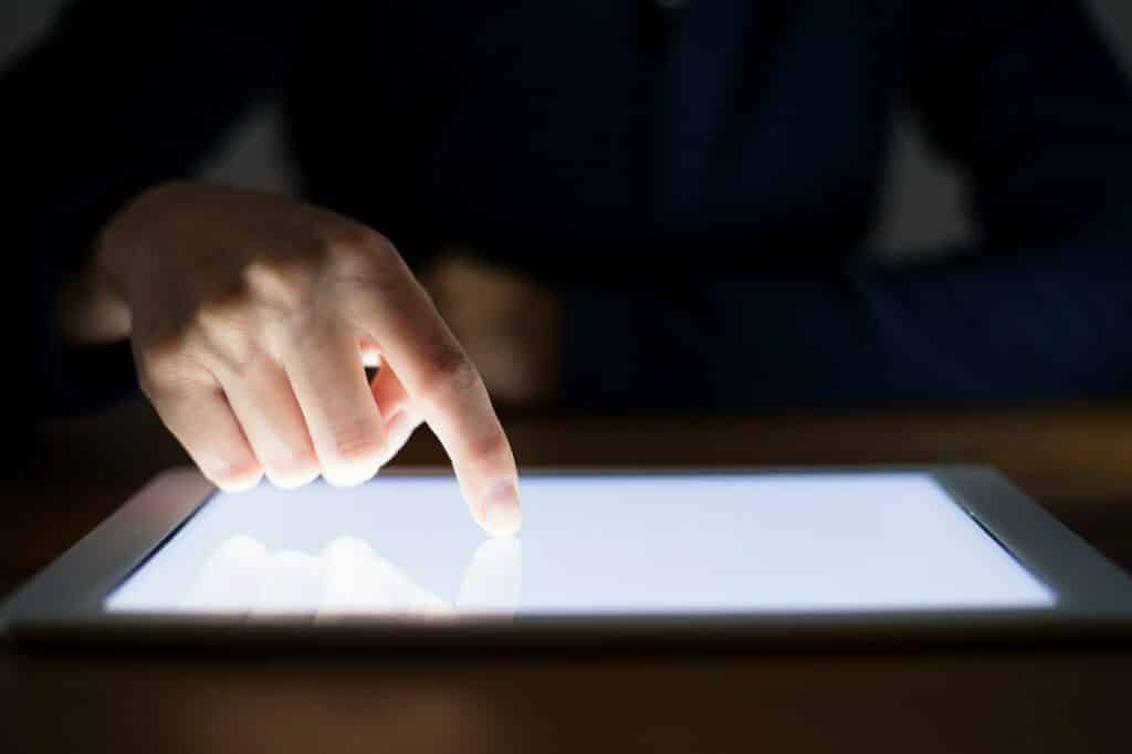 Woman finger touch on the screen of digital tablet
