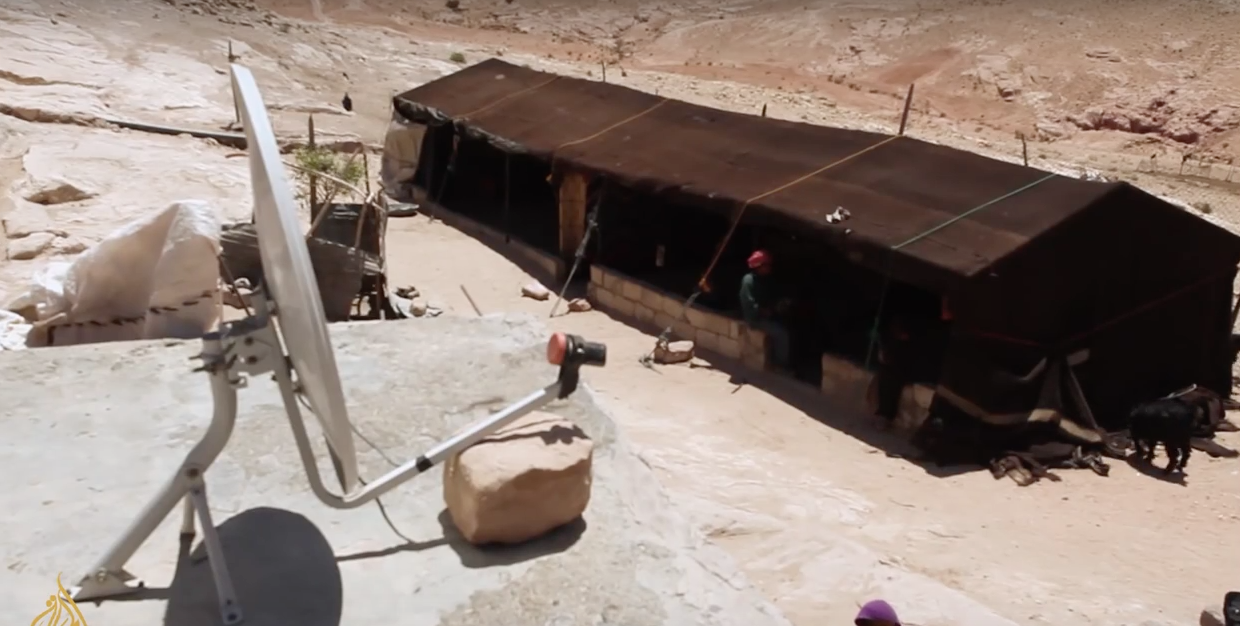 Even satellite discs can be found in Petra. Screenshot from a video by Al-Jazeera: “The Bedouin of Petra”.