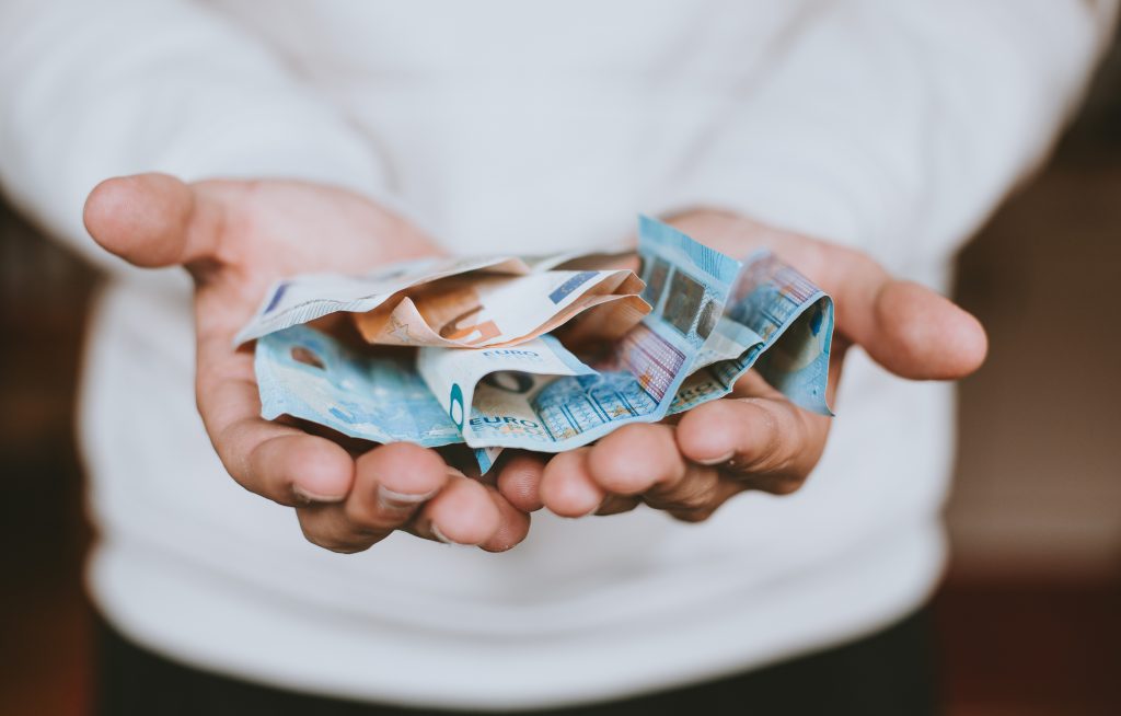 Man holding euro banknotes