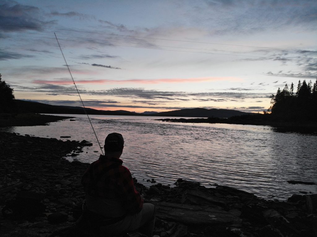 Waiting for the hatch Fly Angler fishing for trout and Arctic char at Skålestrømmen Norway