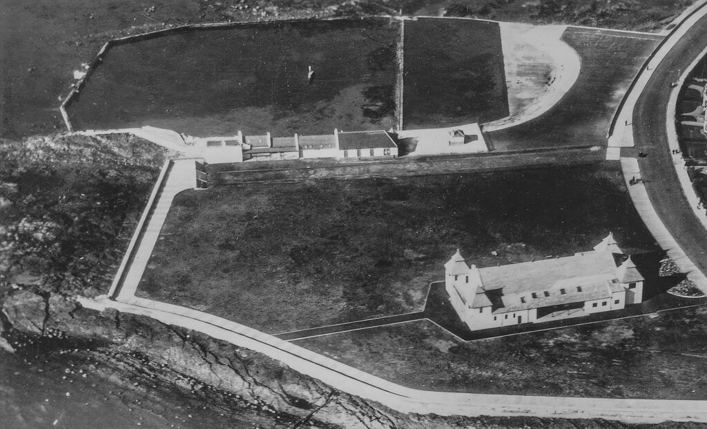 An aerial view of the bathing place and yachting pond from the east, with the 1914 wash house visible just to the right of the the bathing house. Photo by Aerofilms, from an old postcard.