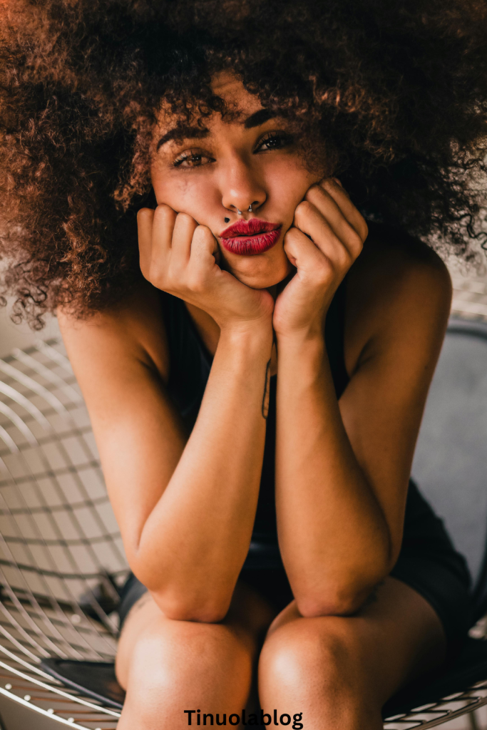 Image of a woman reflecting on her experience with a controlling boyfriend.