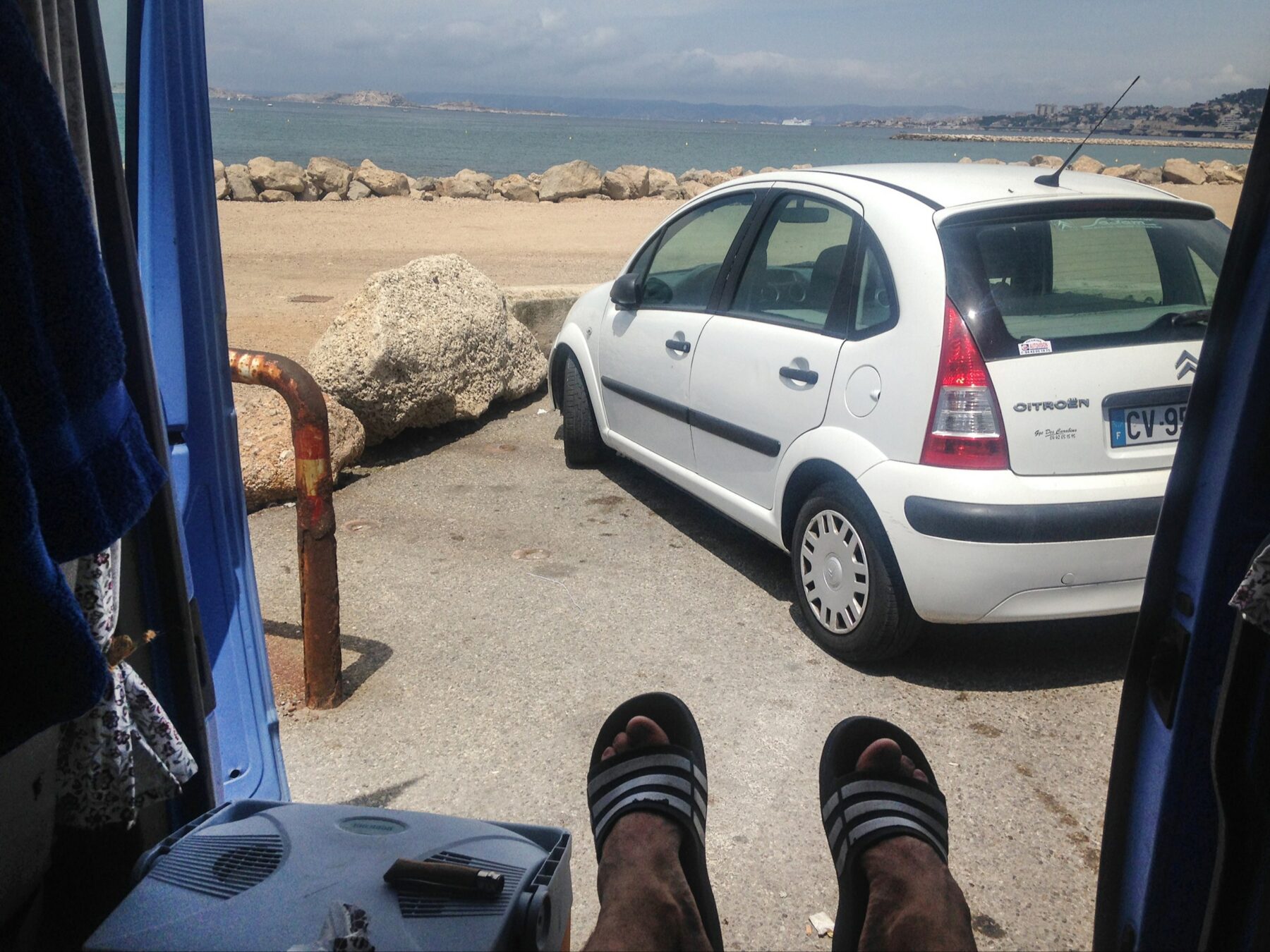 Abdriften - Zielloses Reisen, typical action view out of the car on a parking area in Marseille, 2018