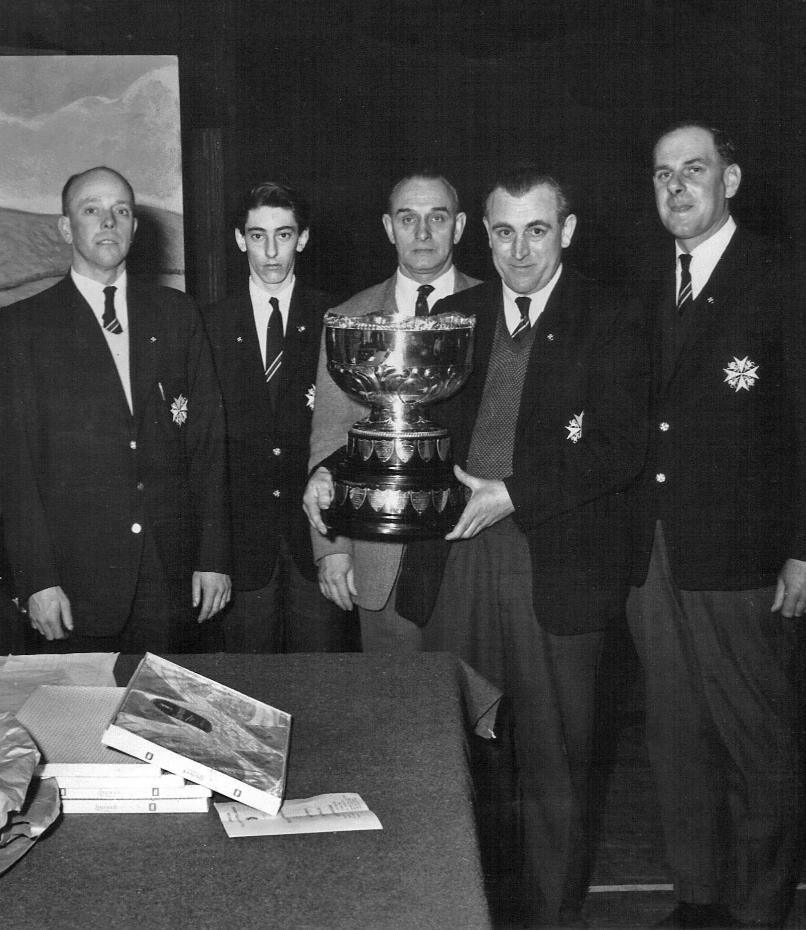 The Grantham Railway Ambulance Team (St John’s Ambulance Brigade) were presented with the Liddle Steel Bowl at the BR Eastern Region Headquarters at Liverpool Street Station in London on 15 March 1965. From left to right: o Bernard Knipe, signalman at Grantham North o David Frankish, telegraph lad at Grantham North o Joe Booth, relief signalman o Ron Harris, signalman at Barrowby Road, High Dyke, Honington o Jim Drury, signalman at Barkston South (among other places) Photograph kindly sent by Julia Lee, daughter of Joe Booth. Dad enjoyed being in the Brigade – he received an extra free travel pass! He was also in the Home Guard but not with the railway regiment.