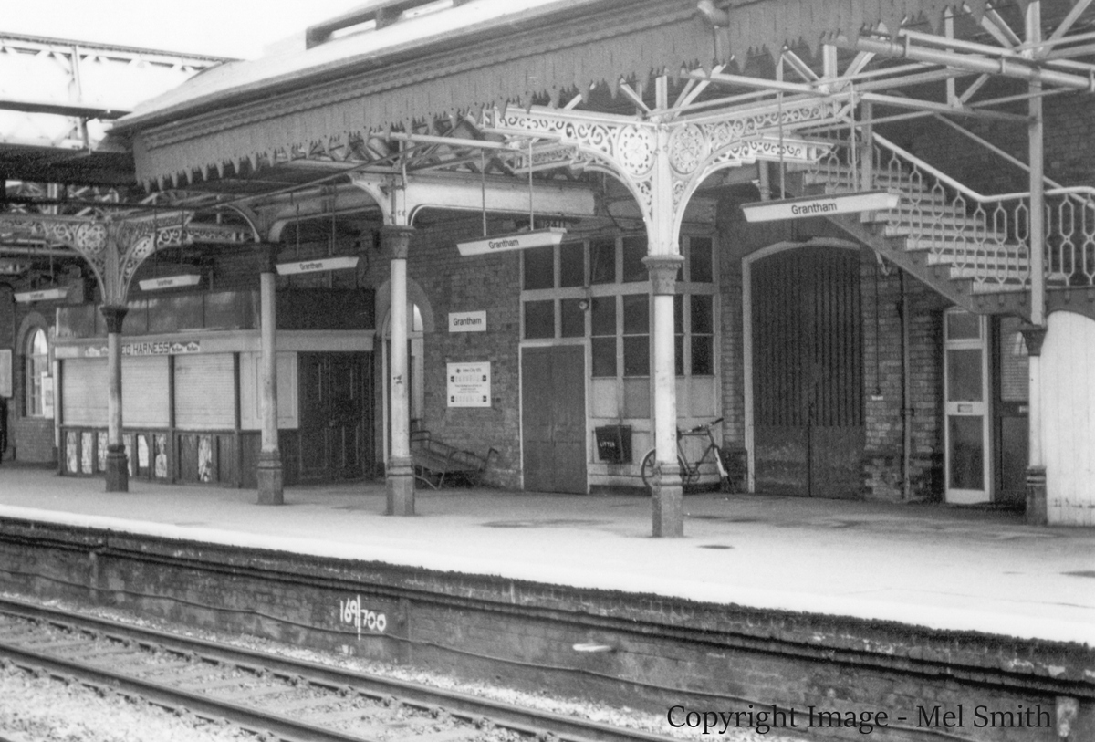 Left to right:- Book Stall, "Postal Authorities Room" Luggage Entrance & Enquiries. The stairs to the footbridge are just coming into view. Copyright Image - Mel Smith