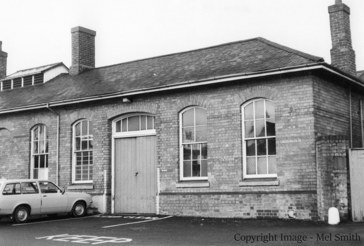 Back through the subway and further up on the right we come to the first group of single storey station buildings. From right to left are a Guards' Room, a store for fish, a Porters' Room and the Gents' toilet with ventilated roof. Copyright Image - Mel Smith