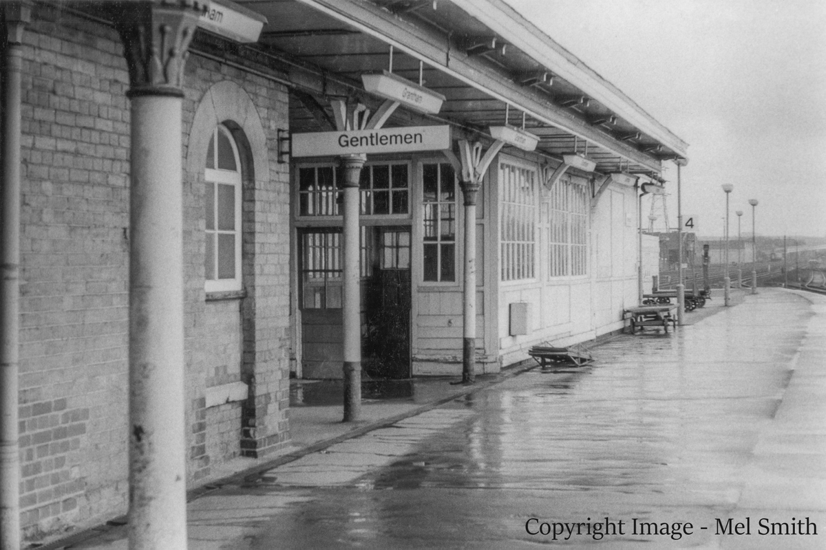 The southern end of platform 4, looking south. Beyond the end of the brick building is the Tranship Area, where consignments of goods awaiting onward shipment by passenger train were stored and sorted. Copyright Image - Mel Smith