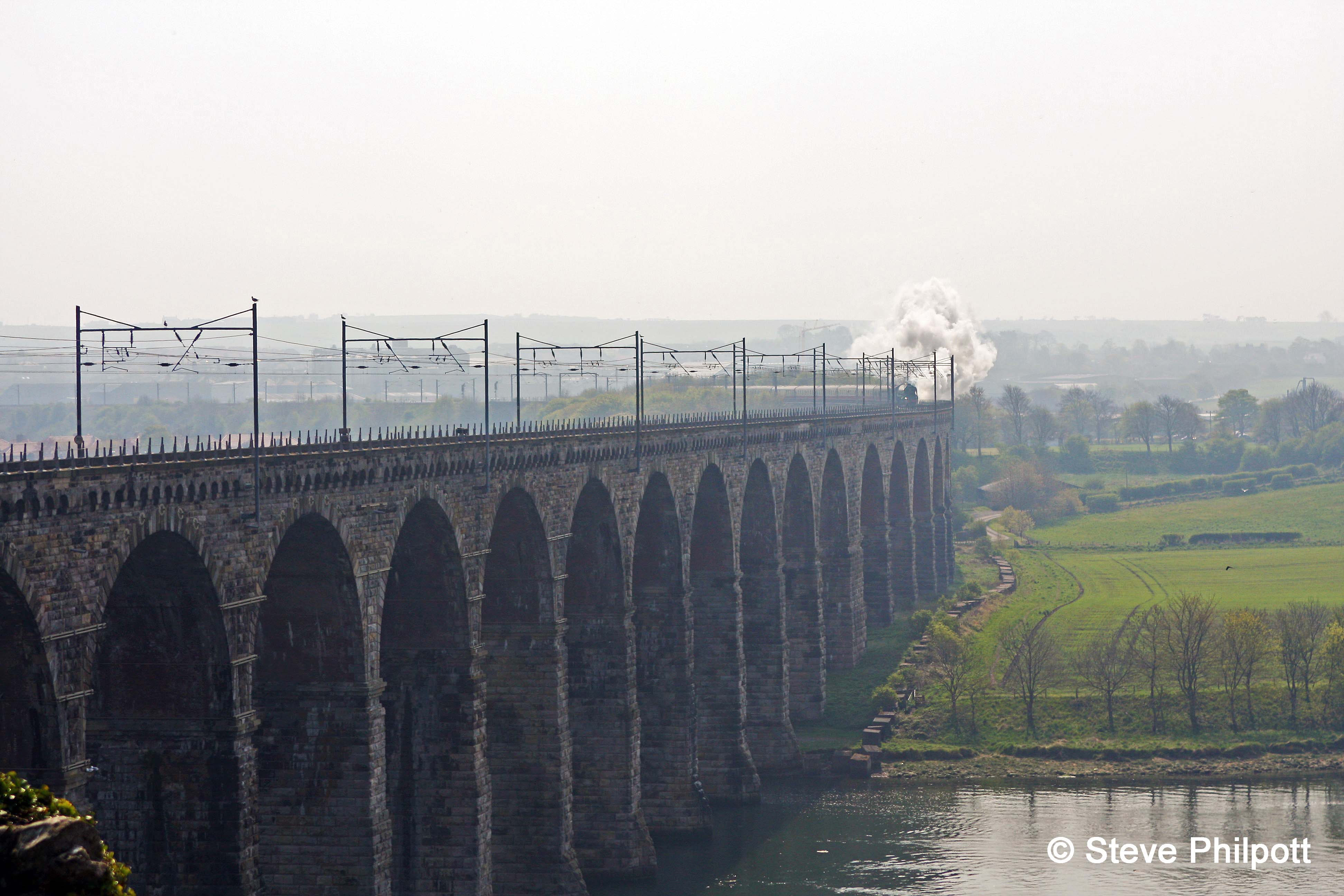 Tornado makes a fine sight, in the distance, as she passes Tweedmouth and heads onto the Royal Border Bridge over the River Tweed.