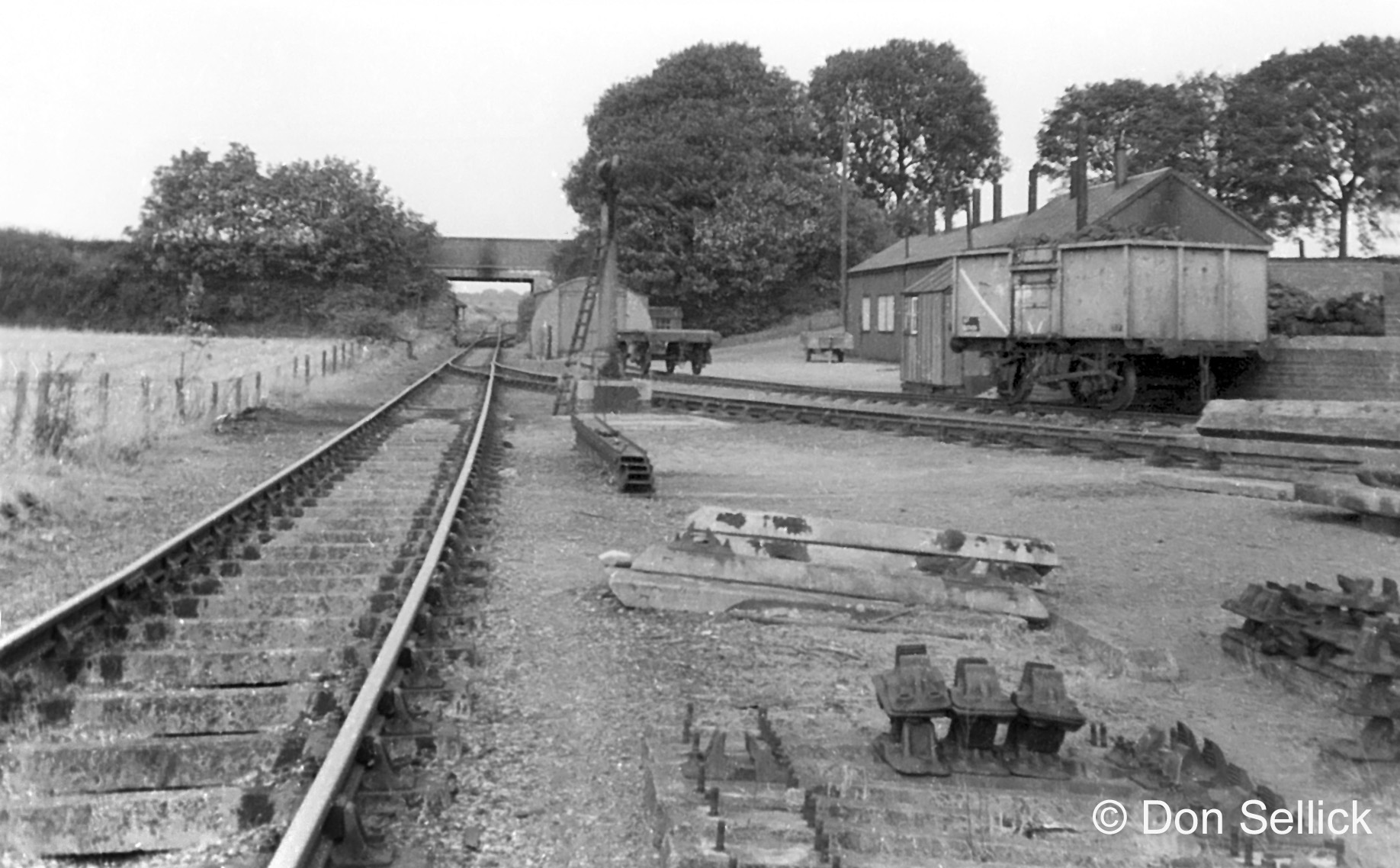 There's the bridge beneath Denton Lane which curves to the right in the distance to join the Woolsthorpe Branch. The wagon on the right contains coal for Denton and the other the steam locos at the Harston and Denton mines. This photograph was taken by Don Sellick 