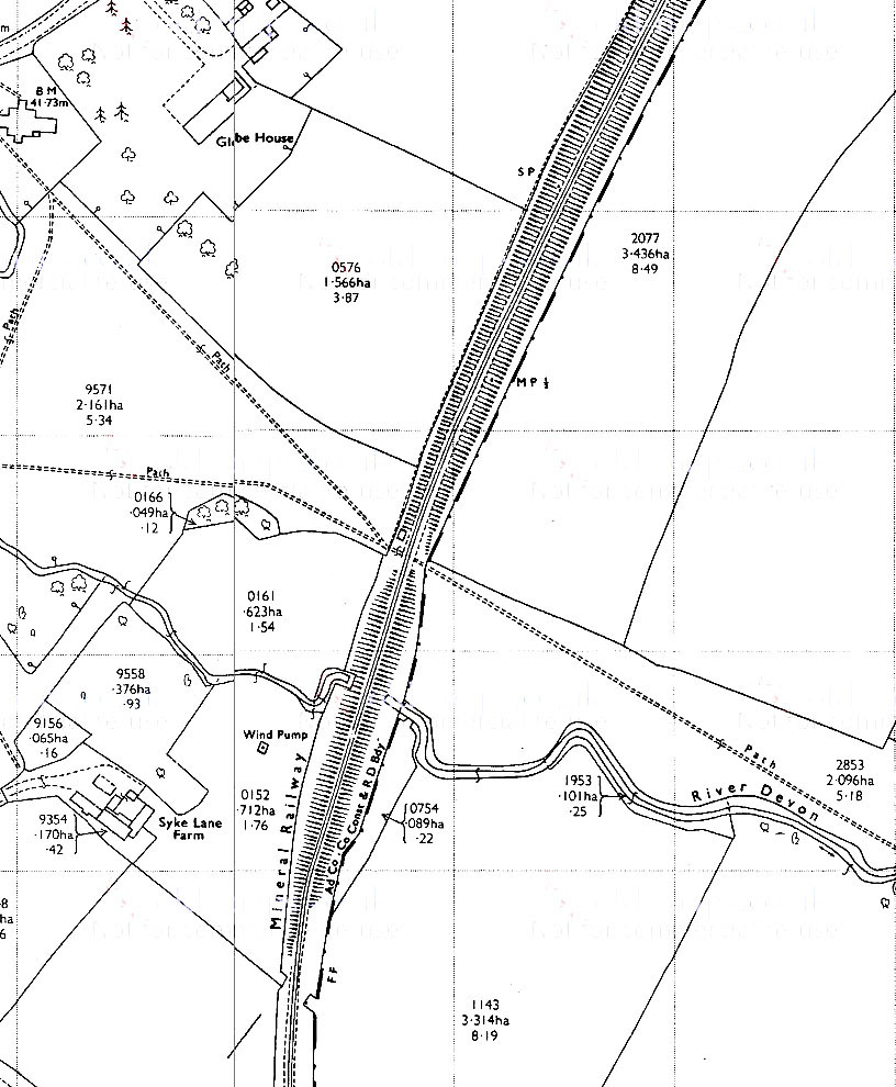 The cutting leads in from top right. The small letters 'SP' identify the location of the concrete signal post. Further south is the bridge or culvert which carries the River Devon through the railway embankment.