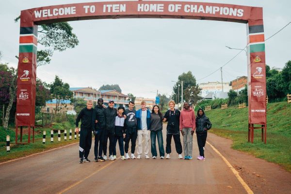 Young Athlete Camp Runners under the Iten Home of Champions Arch