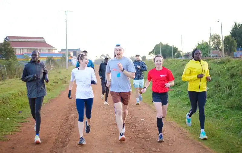 Kenya Experience Running Camp Guests and Pacers on a Morning Run in Iten