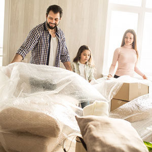 family packing with bubblewrap