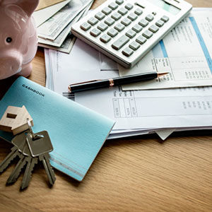 papers calculator cashbook on desk