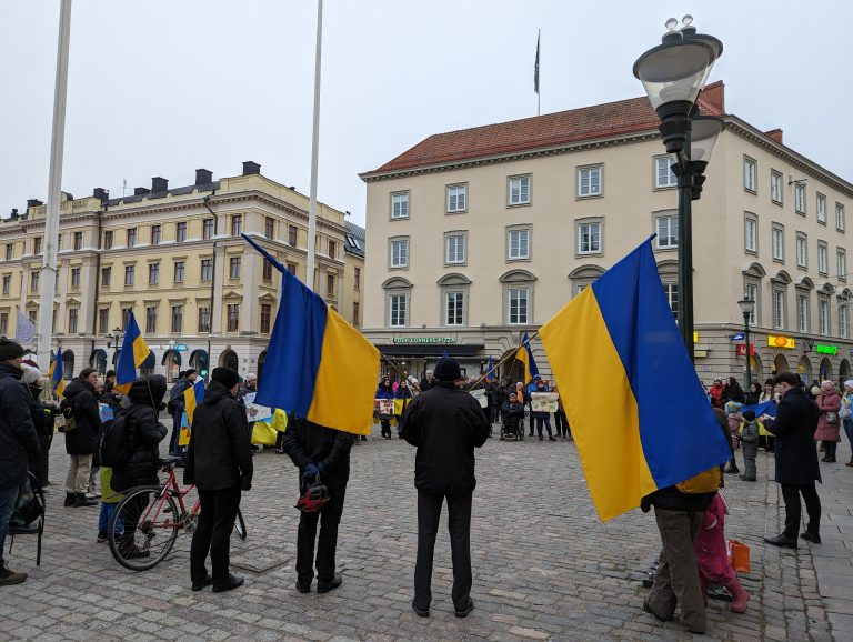 Demonstrat with two ukrainian flags