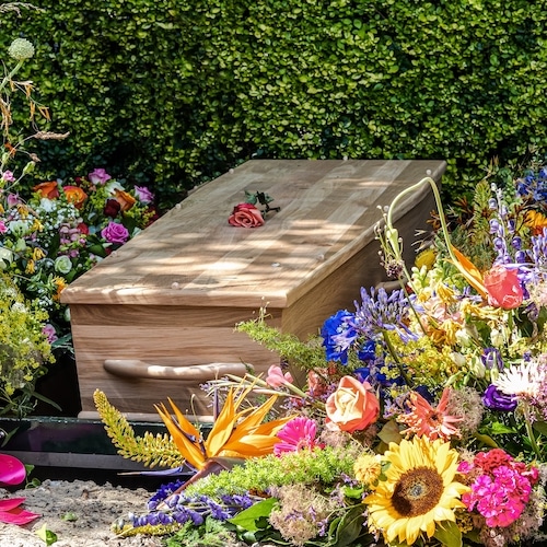 People,Loss,And,Mourning,Concept,,A,Wooden,Coffin,With,Beautiful