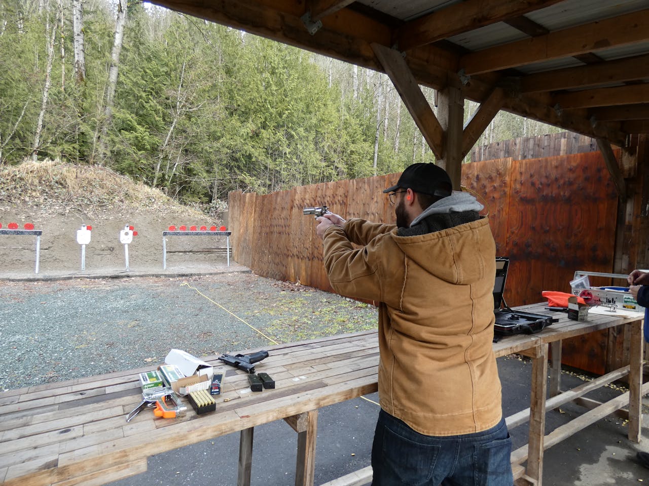 A Man at a Shooting Range