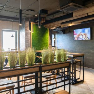 Main hall in the new modern restaurant in freshh green style with exquisite modern furniture