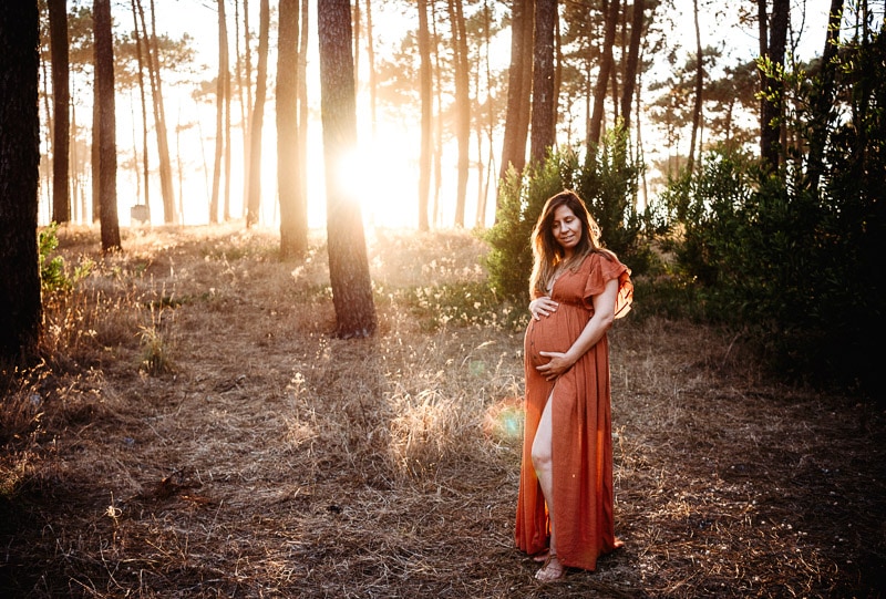 pregnant woman holding belly at sussex maternity photography session